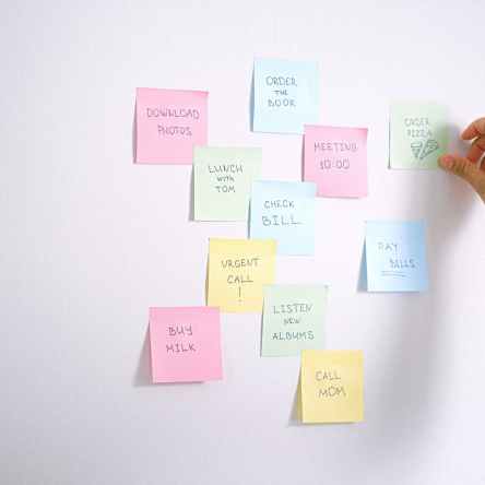 sticky notes with to do list on the white wall