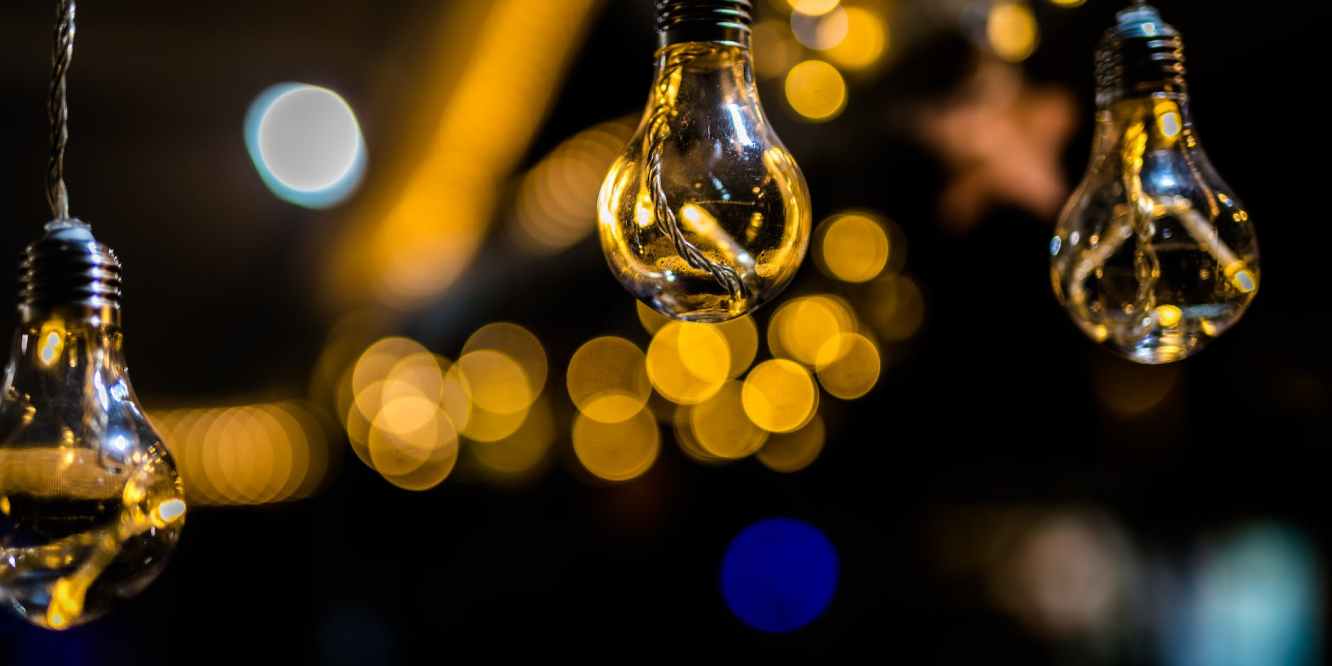 close up photo of three hanging light bulbs